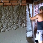 Bagaimana dinding plaster dengan mortar simen?