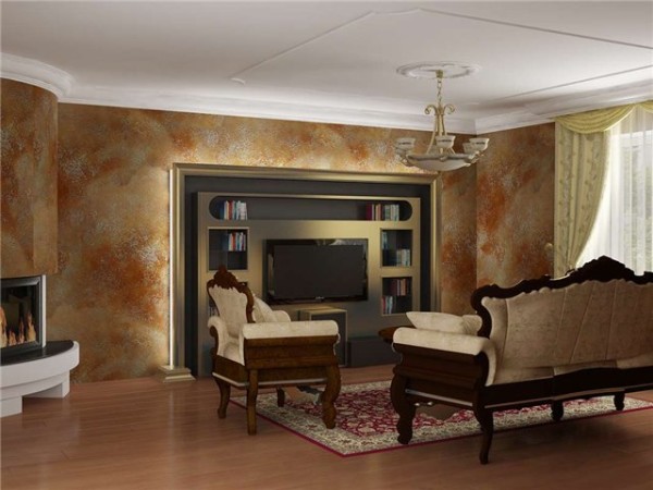 Dinding ruang tamu dihiasi dengan plaster hiasan.